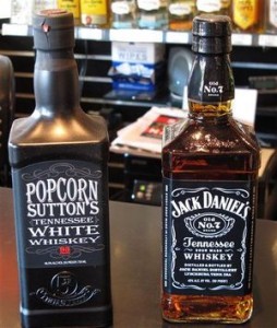 The 2013 version of Popcorn Sutton next to a bottle of Jack Daniel's.